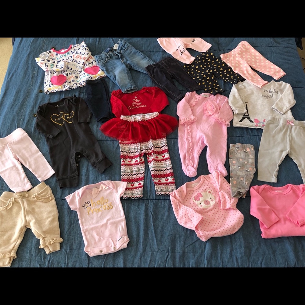 Lot of baby girl clothing.